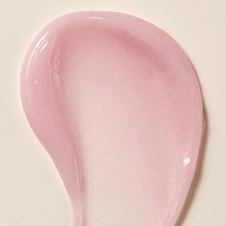 Axis-Y Calamine Pore Control apsule Serum texture reference. The serum is of a light pink gel consistency with tiny capsules in it.