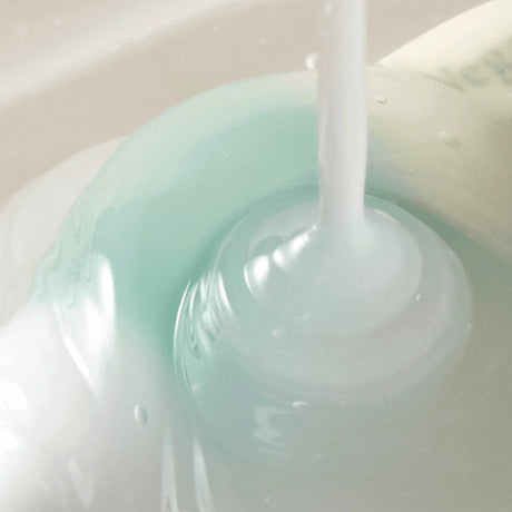 Axis-Y Vegan Collagen Eye Serum texture reference. The eye serum is of a cloudy gel consistency.