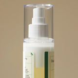 Image showing the two layers of the toner inside the bottle when they have not been mixed. The bottle has a spray cap.